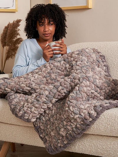 Blanket Stitch Trim Blanket by Yarnspirations Design Studio